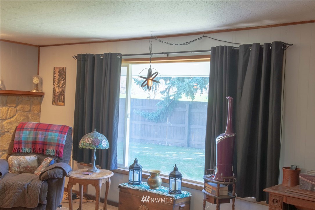 78 Mundy Road Twisp, WA 98856 - Photo 9 of 40 a bedroom with furniture and a window