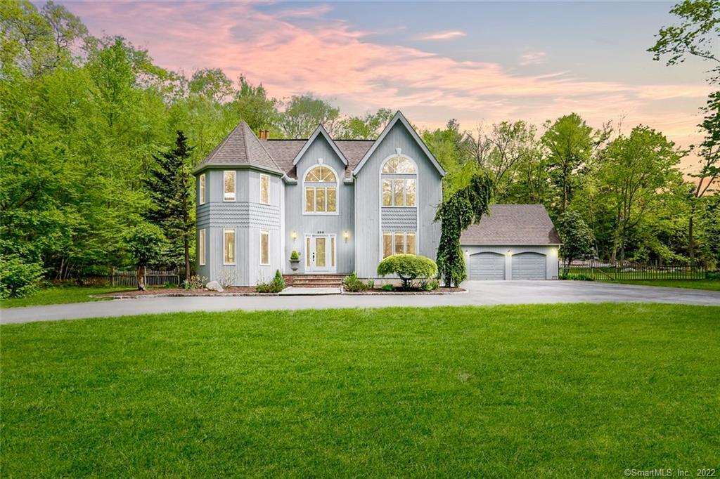 230 Hammertown Road Monroe, CT 06468 - Photo 1 of 1 a front view of a house with a yard and trees