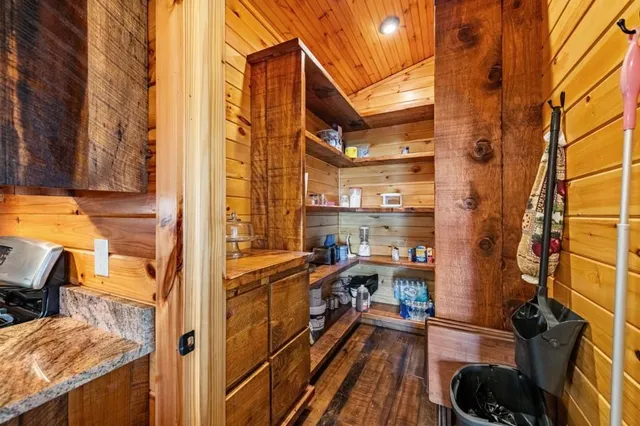 a view of a balcony with wooden floor
