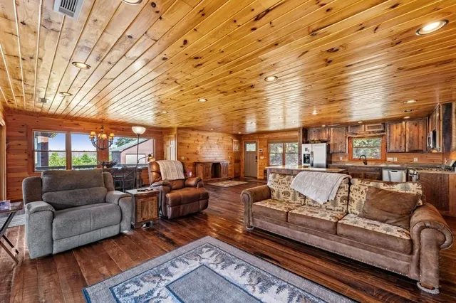 a bathroom with a granite countertop sink a mirror and a shower