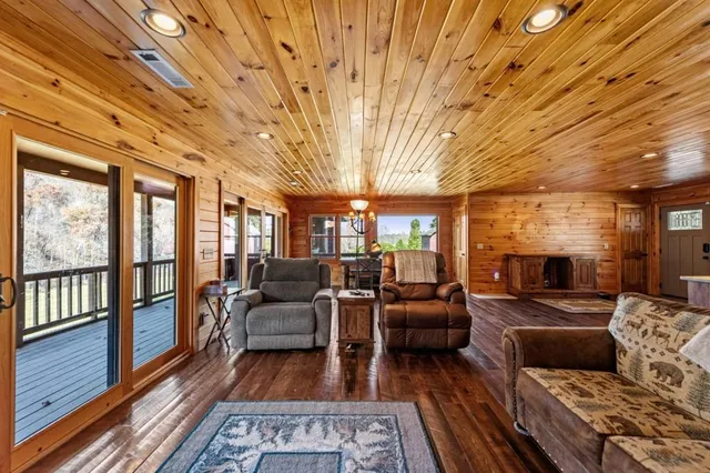 a bathroom with a granite countertop sink mirror and toilet
