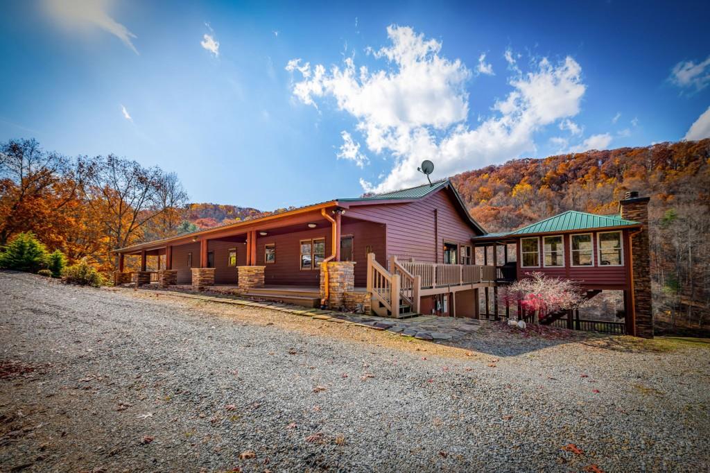 908 Cashes Valley Road Cherry Log, GA 30522 - Photo 3 of 90 a view of a house with a yard