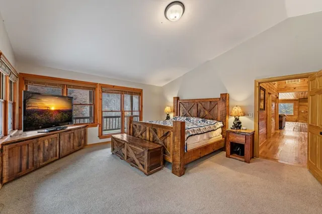 a view of a kitchen with a sink and a refrigerator