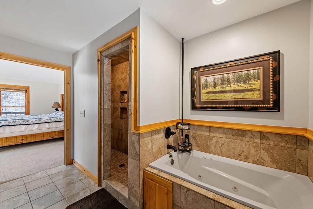 908 Cashes Valley Road Cherry Log, GA 30522 - Photo 39 of 90 a bathroom with a tub and a sink
