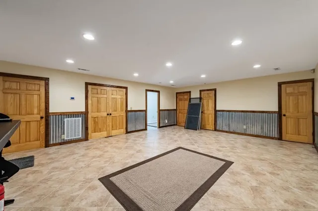 a view of a house with pool and a yard