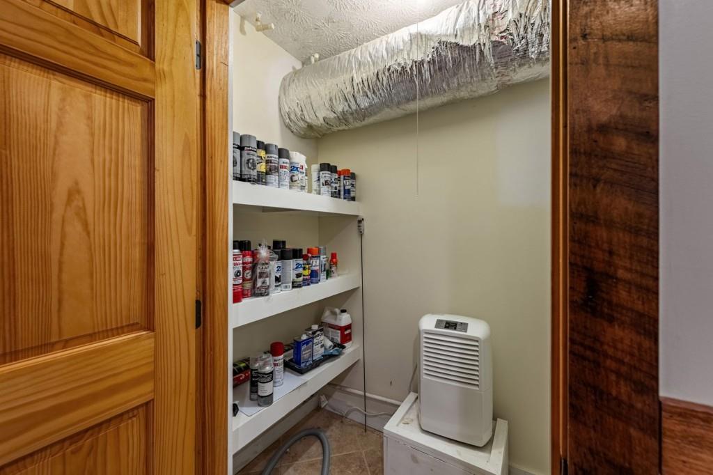 908 Cashes Valley Road Cherry Log, GA 30522 - Photo 57 of 90 a room with a book shelf and a wooden door