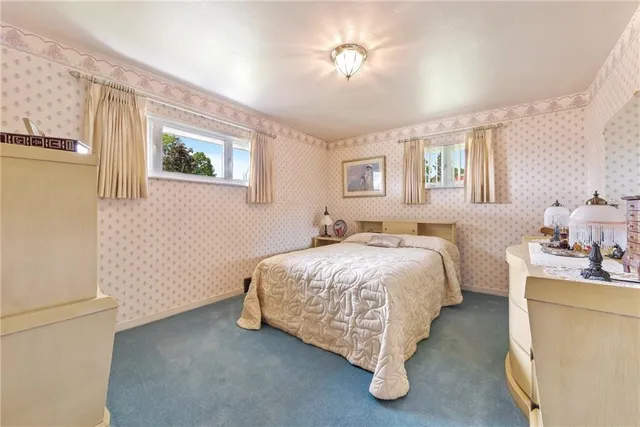 a bed room with a bed and a chandelier