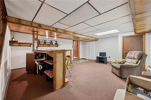 a view of a livingroom with workspace and a couch