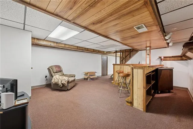 a bed room with a bed and a chair