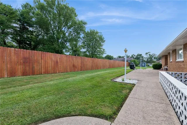 a view of a backyard with green space
