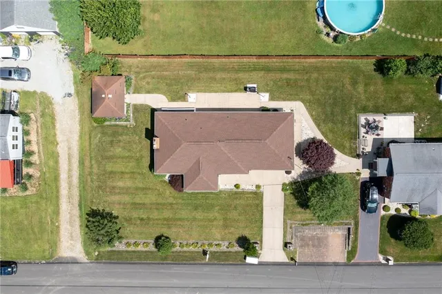 an aerial view of a house with a lake view