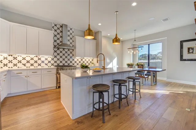 a kitchen with a sink cabinets and window