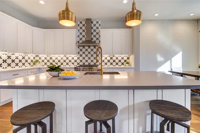 a stove top oven sitting inside of a kitchen
