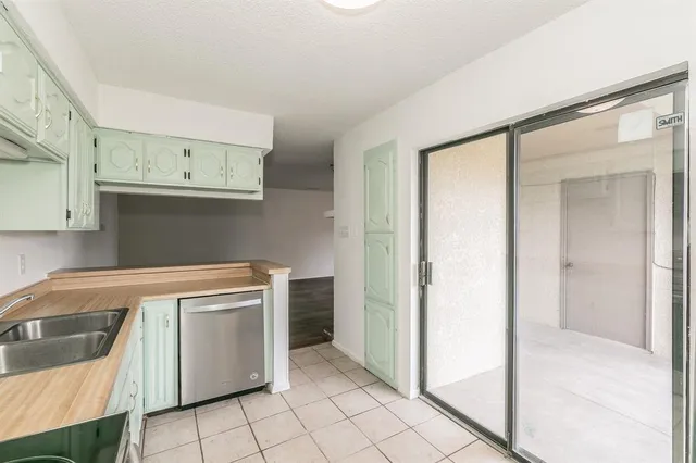 a view of a kitchen with storage and utility