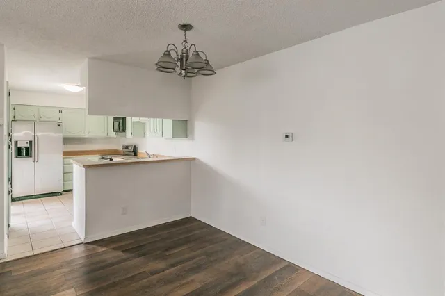 a view of a kitchen with a sink and dishwasher
