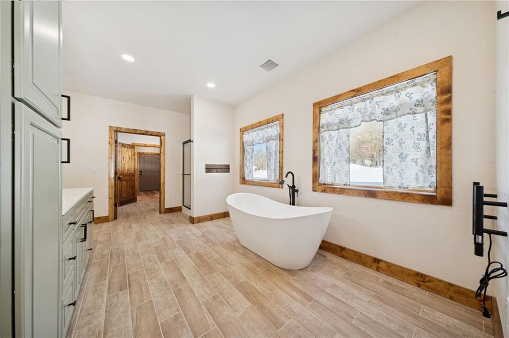 223 Deer Fern Drive Somerset, PA 15501 - Photo 13 of 37 a view of an empty room with wooden floor and a window