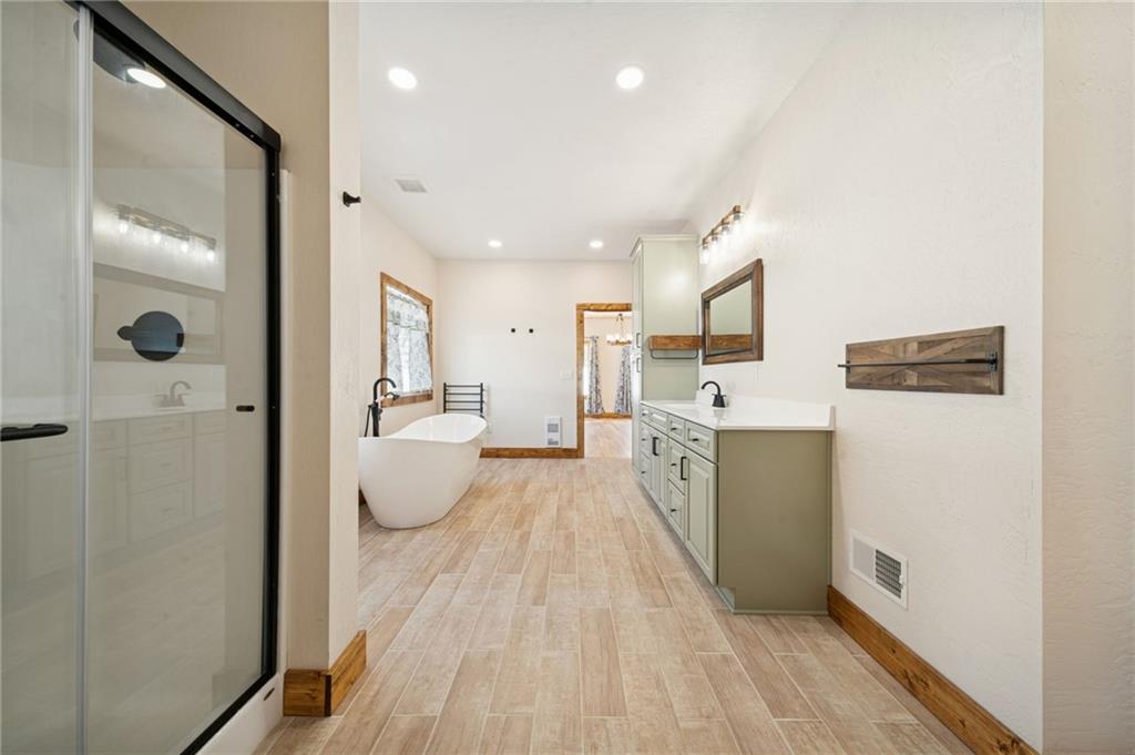 223 Deer Fern Drive Somerset, PA 15501 - Photo 14 of 37 a bathroom with a double vanity sink and mirror