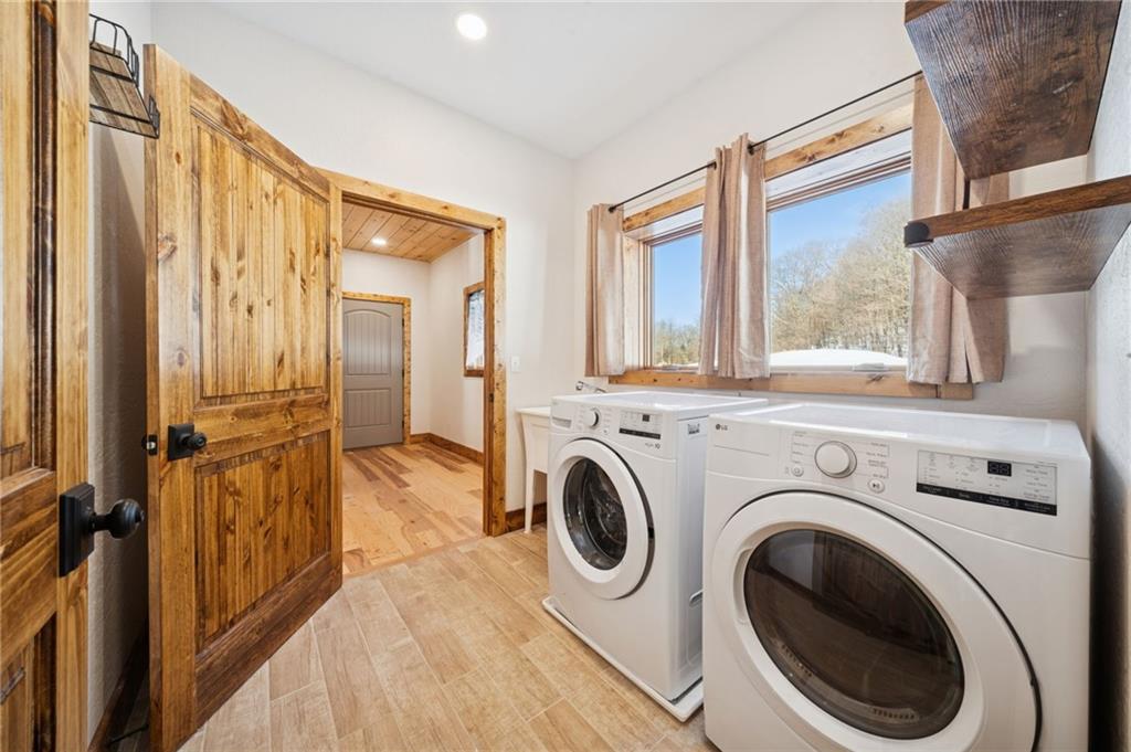 223 Deer Fern Drive Somerset, PA 15501 - Photo 15 of 37 a view of a hallway with washer and dryer