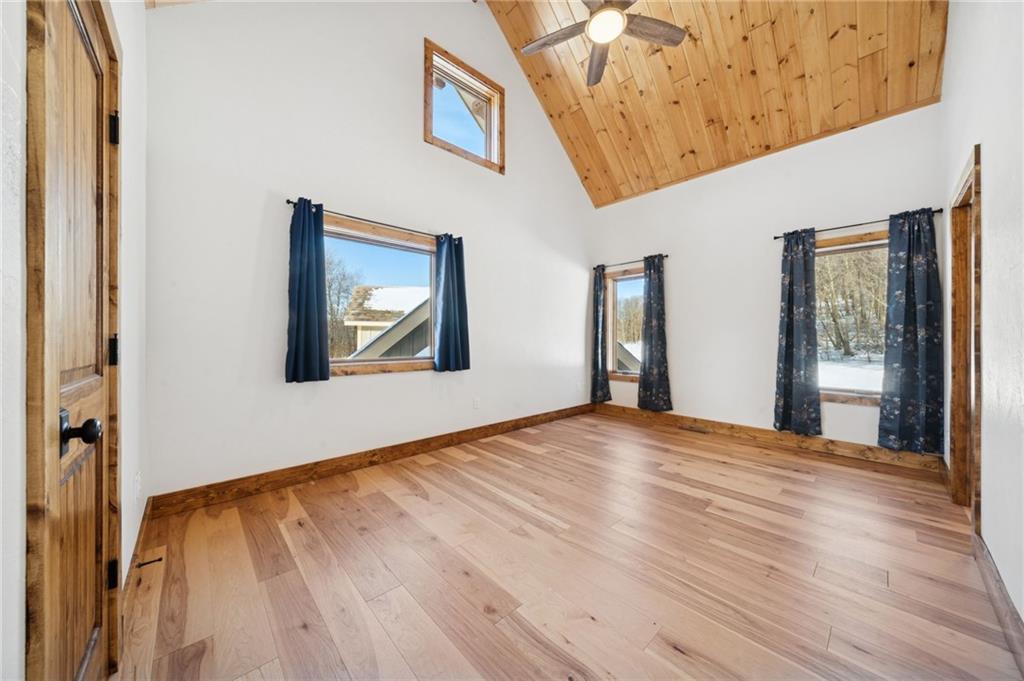 223 Deer Fern Drive Somerset, PA 15501 - Photo 18 of 37 a view of an empty room with wooden floor and a window