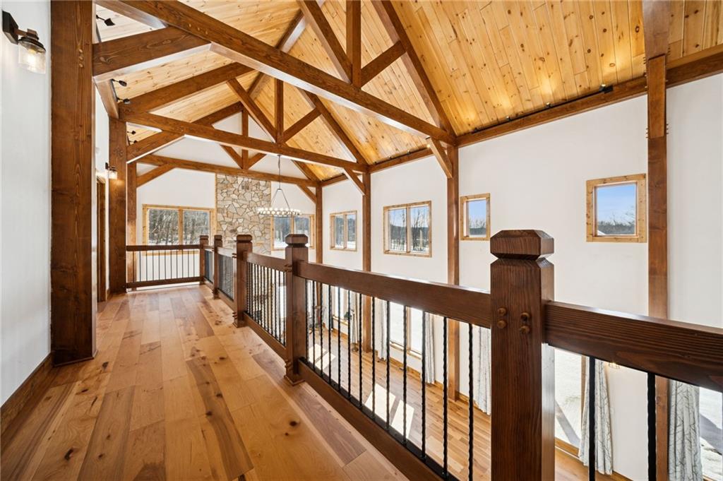 223 Deer Fern Drive Somerset, PA 15501 - Photo 21 of 37 a view of a porch with wooden floor and iron stairs