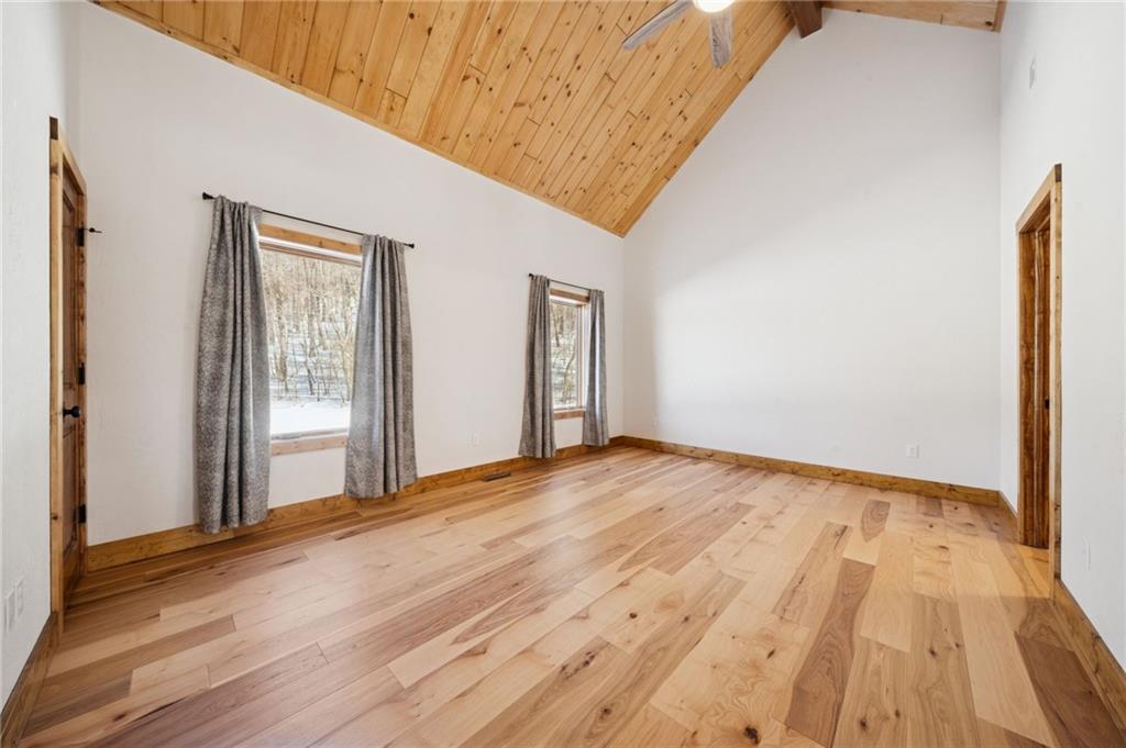 223 Deer Fern Drive Somerset, PA 15501 - Photo 22 of 37 a view of an empty room and wooden floor