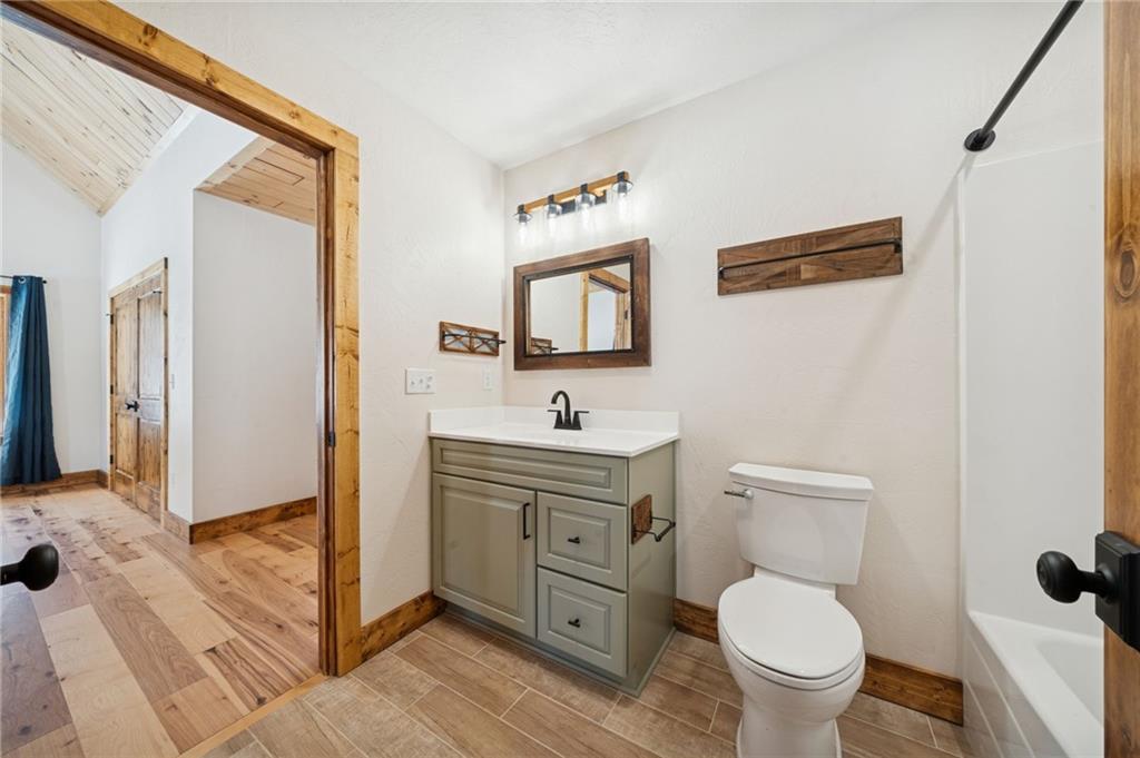 223 Deer Fern Drive Somerset, PA 15501 - Photo 24 of 37 a bathroom with a toilet a sink and a mirror