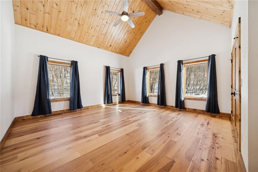 223 Deer Fern Drive Somerset, PA 15501 - Photo 26 of 37 a view of an empty room with window and wooden floor
