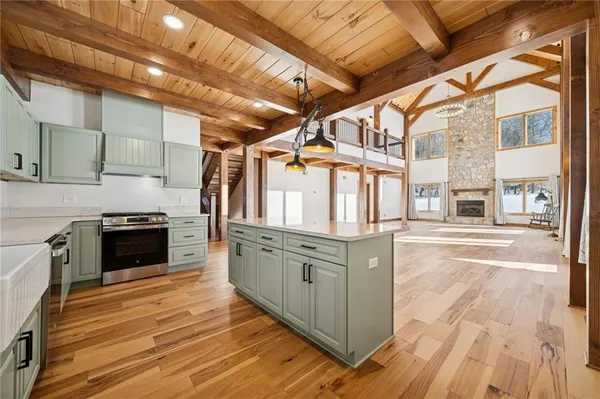 a kitchen with stainless steel appliances granite countertop a stove and a refrigerator