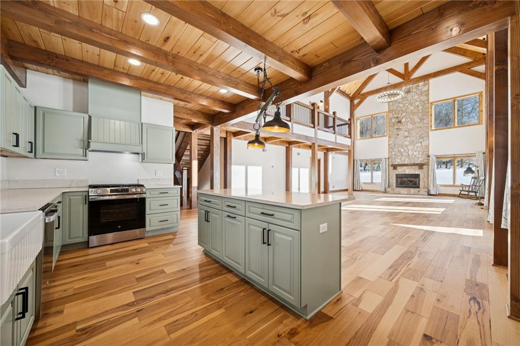 223 Deer Fern Drive Somerset, PA 15501 - Photo 6 of 37 a kitchen with stainless steel appliances granite countertop a stove and a refrigerator