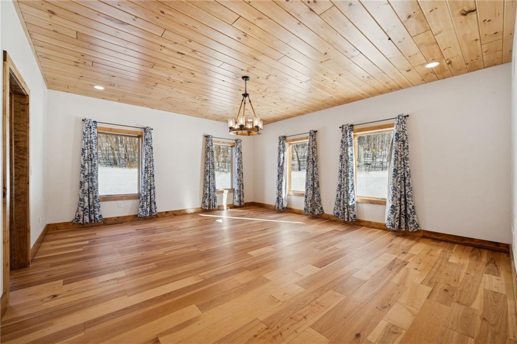 223 Deer Fern Drive Somerset, PA 15501 - Photo 10 of 37 a view of empty room with wooden floor and fan