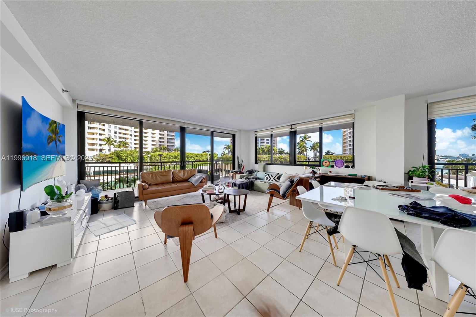 540 Brickell Key Drive, Unit 608 Miami, FL 33131 - Photo 13 of 15 a living room with fireplace furniture and a large window