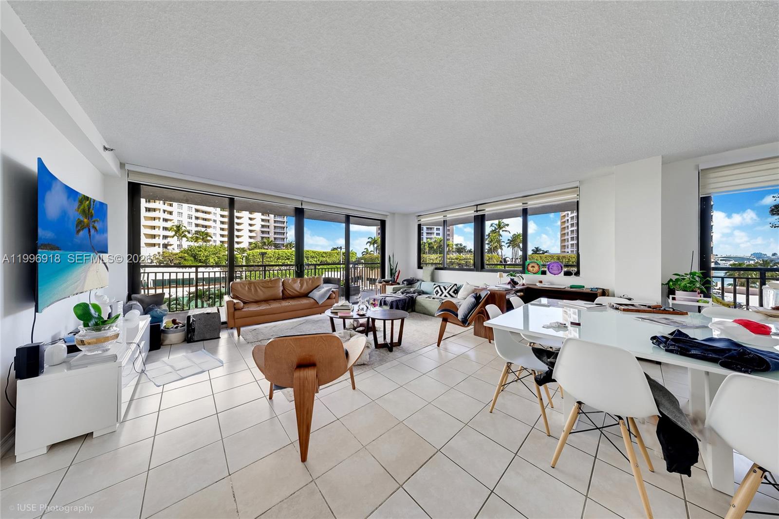540 Brickell Key Drive, Unit 608 Miami, FL 33131 - Photo 14 of 15 a living room with furniture and a large window