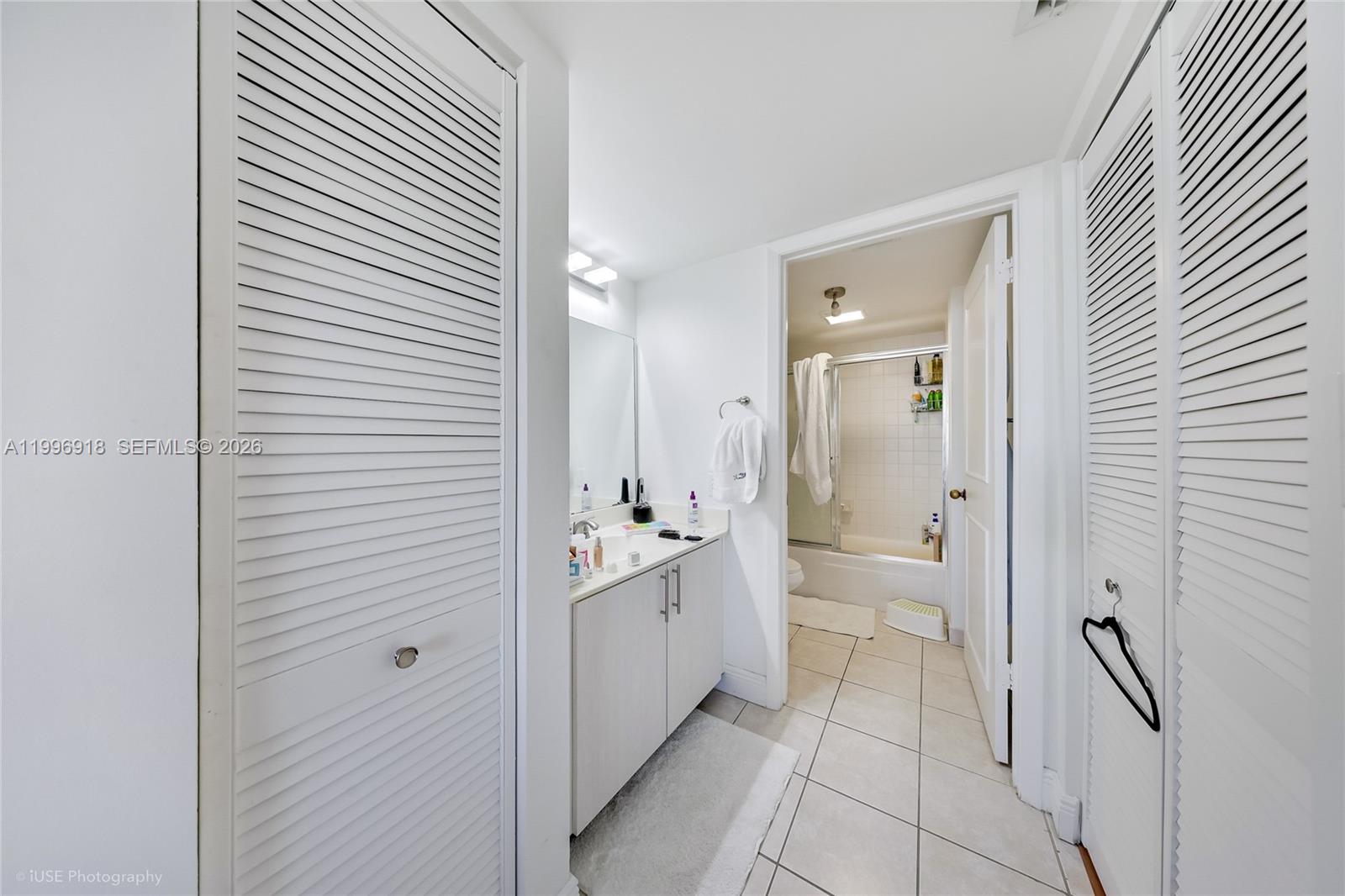 540 Brickell Key Drive, Unit 608 Miami, FL 33131 - Photo 7 of 15 a bathroom with a glass door shower and a sink
