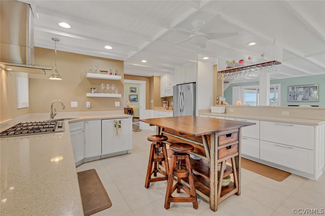 324 Fleet Road Heathsville, VA 22473 - Photo 17 of 49 a kitchen with stainless steel appliances granite countertop a stove a sink dishwasher and a refrigerator with wooden floor