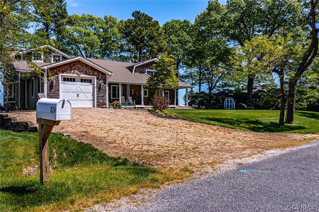 324 Fleet Road Heathsville, VA 22473 - Photo 3 of 49 a front view of a house with a yard and trees