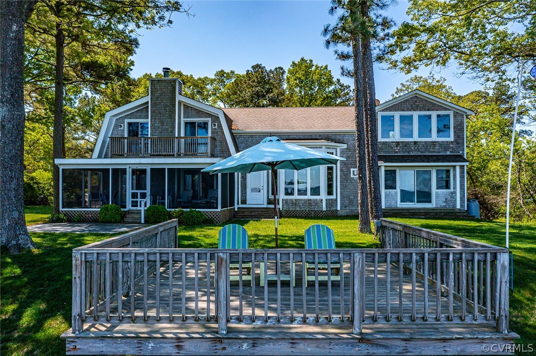 324 Fleet Road Heathsville, VA 22473 - Photo 40 of 49 a front view of a house with a yard table and chairs