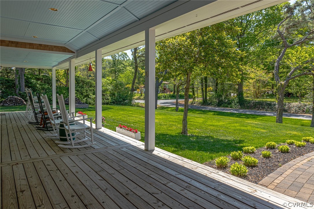 324 Fleet Road Heathsville, VA 22473 - Photo 4 of 49 a view of a deck with a big yard potted plants and large tree