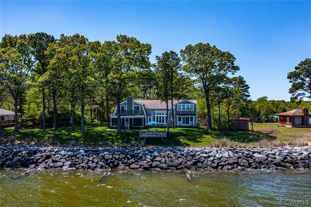 324 Fleet Road Heathsville, VA 22473 - Photo 45 of 49 a view of a lake with a house in the background