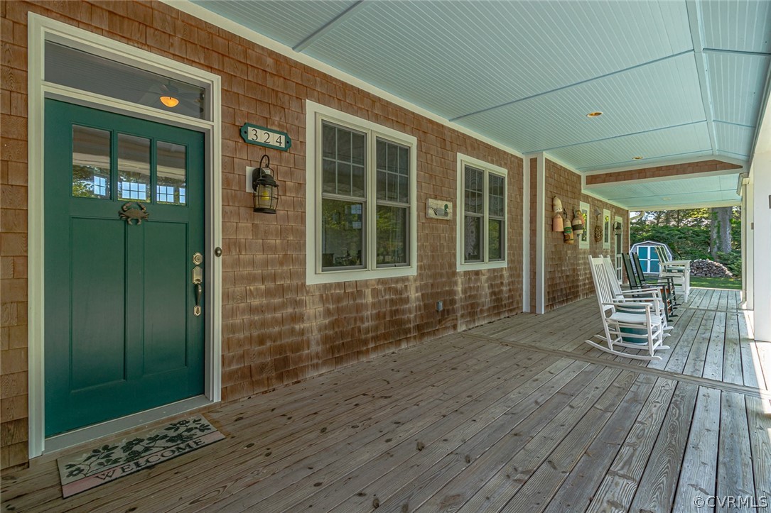 324 Fleet Road Heathsville, VA 22473 - Photo 5 of 49 a porch with chairs and door