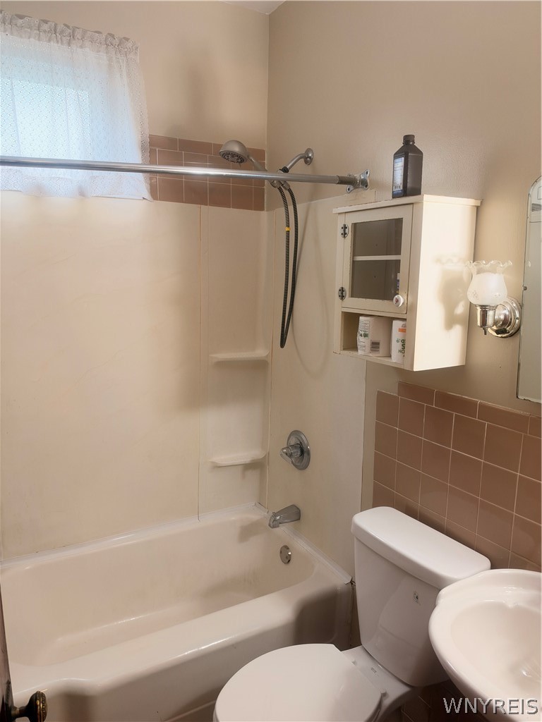 166 Herkimer Street Buffalo, NY 14213 - Photo 10 of 13 Tiled accents and a built-in storage cabinet compl