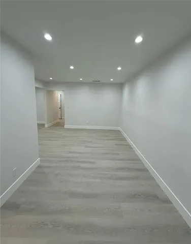 a kitchen with granite countertop white cabinets and sink