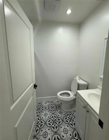 a kitchen with granite countertop a refrigerator and a stove