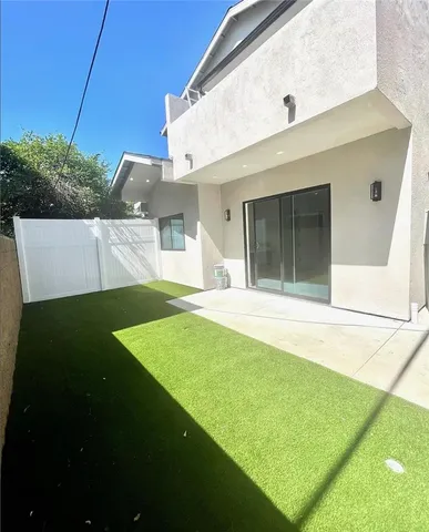 a large kitchen with stainless steel appliances kitchen island a cabinets and wooden floor