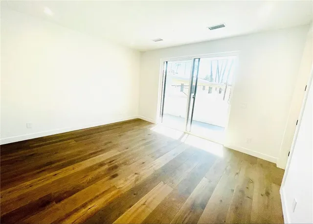 a view of a big room with wooden floor