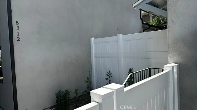 a room with a rug and a wooden floor