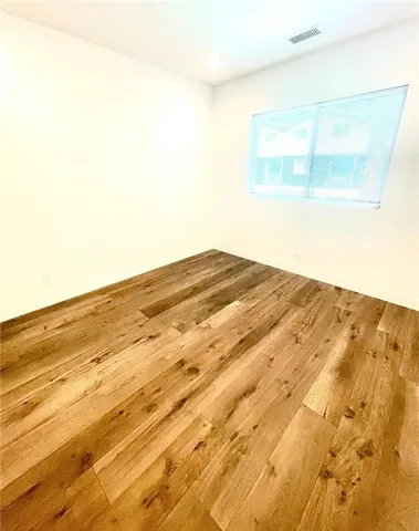 a bathroom with a bathtub shower sink mirror and toilet