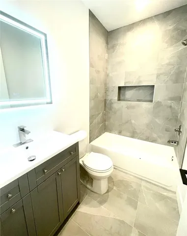 a view of a kitchen with wooden floor and a sink