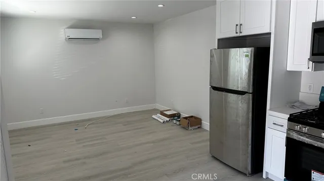a bathroom with a shower and a glass door