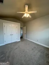 a view of cabinets and wooden floor in a room