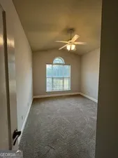 a view of a livingroom with a staircase